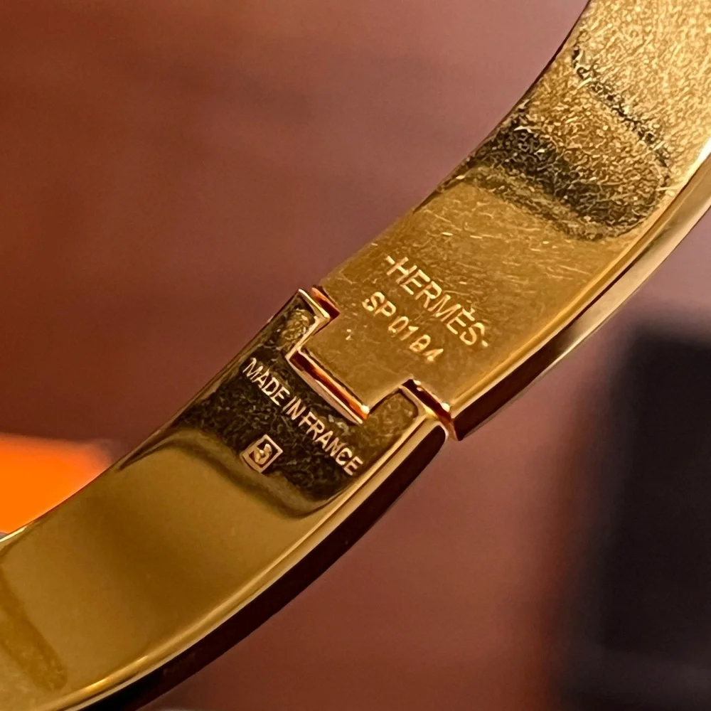 Hermès Clic H Bracelet With Gold and Black Enamel